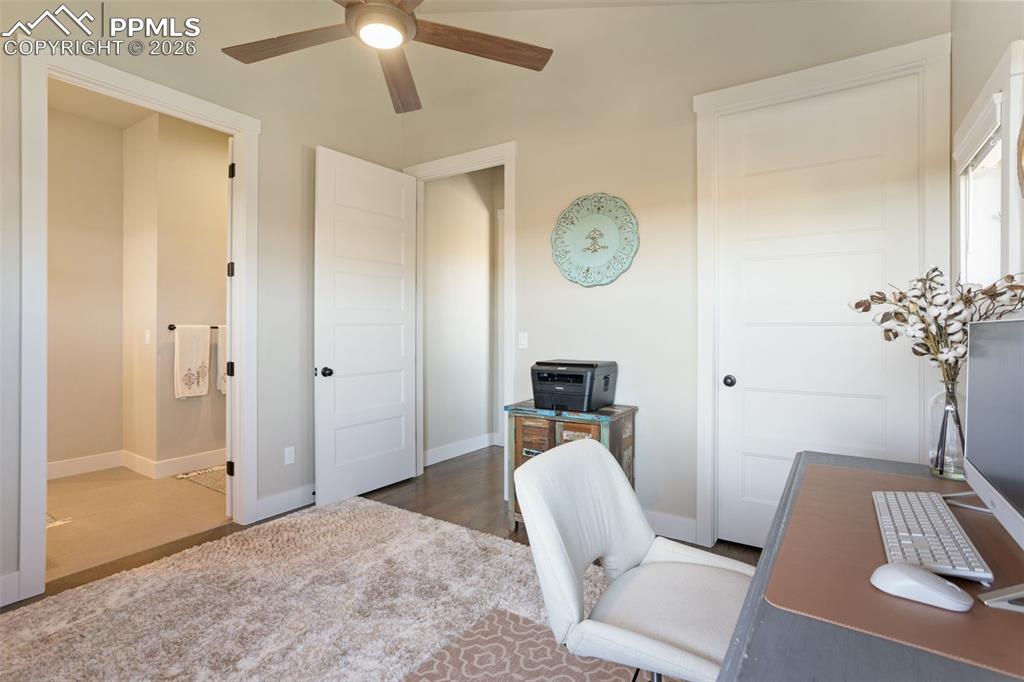 16835 Goshawk Road Colorado Springs, CO 80908 - Photo 16 of 50 a work room with furniture and chandelier