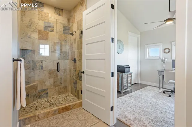 a bathroom with a shower and a sink