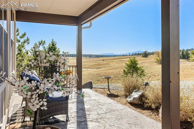 a view of a balcony with chair and table