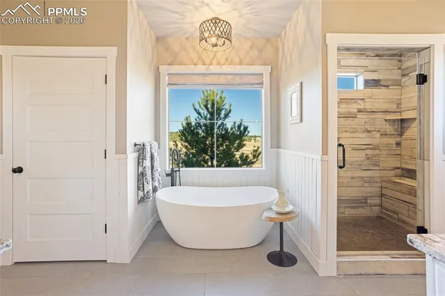 a bathroom with a bathtub and shower