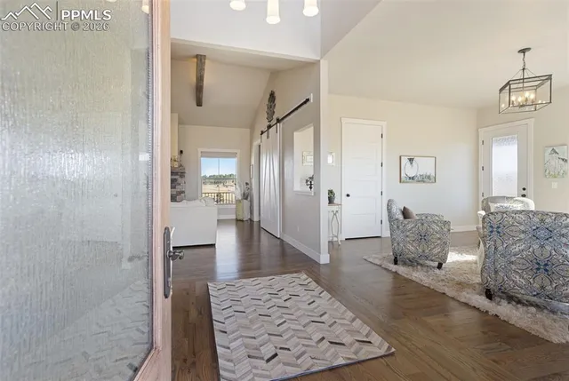 a living room with furniture and a rug