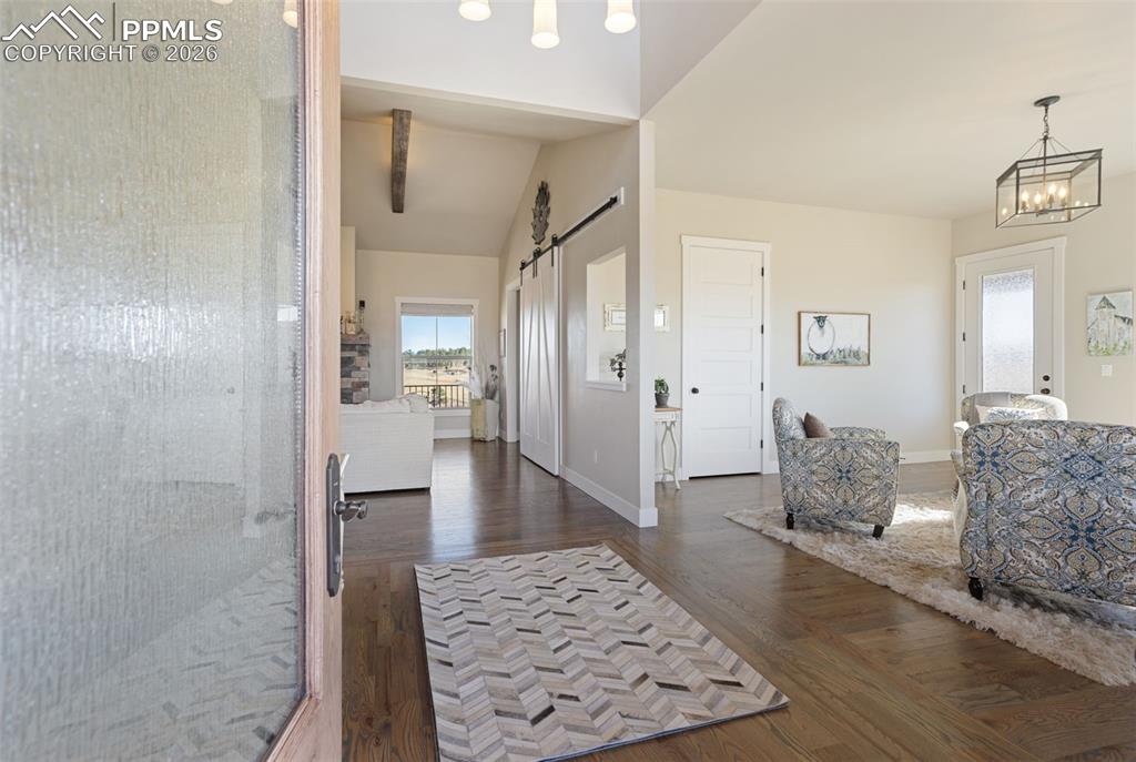 16835 Goshawk Road Colorado Springs, CO 80908 - Photo 3 of 50 a living room with furniture and a rug