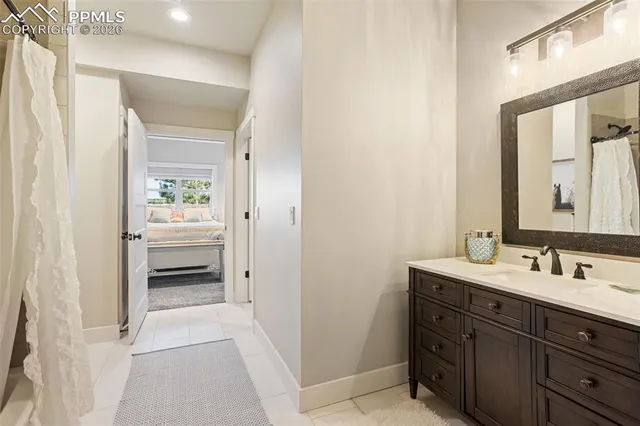 a en suite bathroom with a sink a mirror and a shower