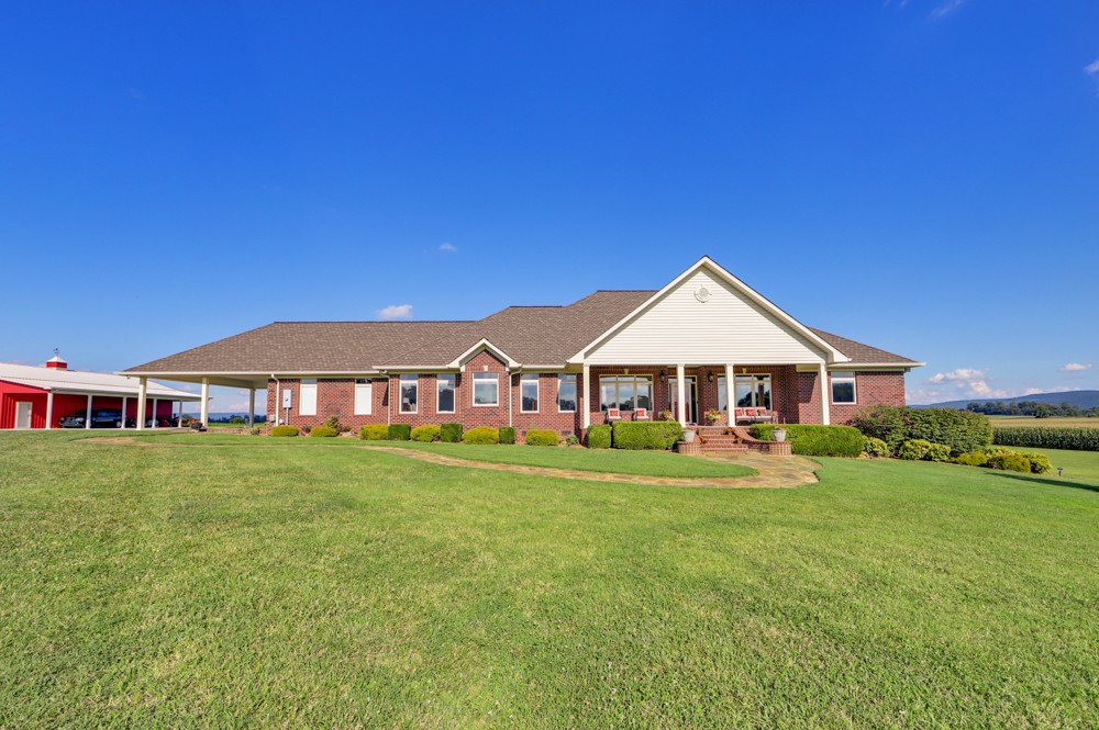 8007 Fountain Grove Road Morrison, TN 37357 - Photo 1 of 45 a front view of a house with garden