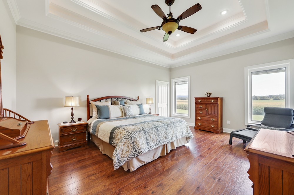 8007 Fountain Grove Road Morrison, TN 37357 - Photo 12 of 45 a bedroom with a bed and wooden floor