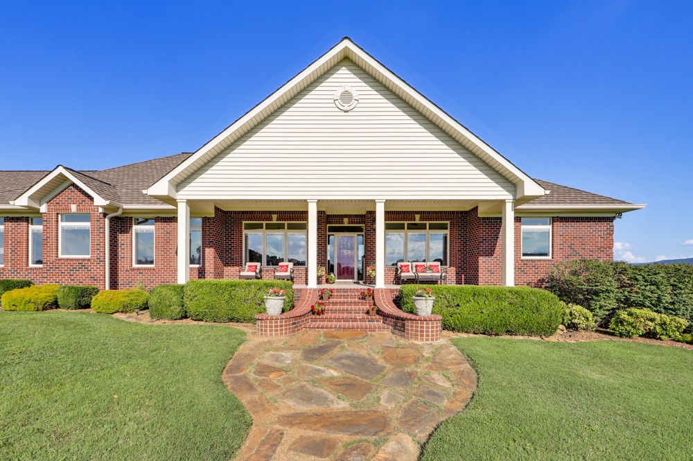 8007 Fountain Grove Road Morrison, TN 37357 - Photo 2 of 45 a front view of a house with yard and green space