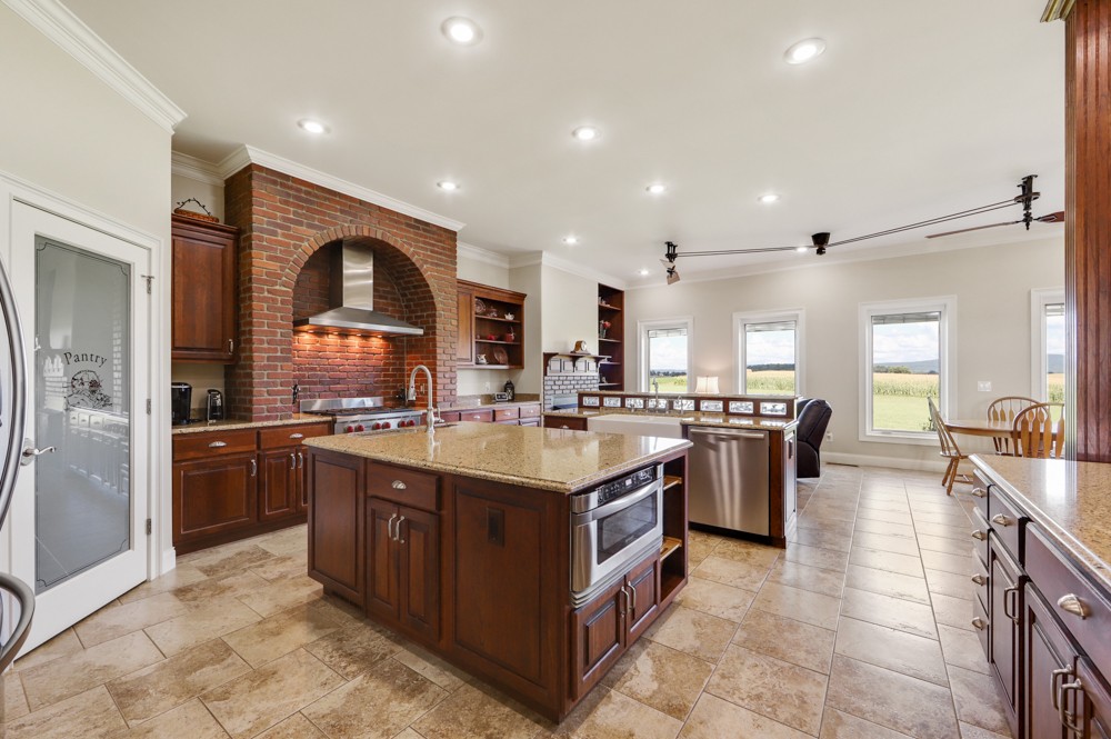 8007 Fountain Grove Road Morrison, TN 37357 - Photo 26 of 45 a kitchen with stainless steel appliances granite countertop a sink and a stove