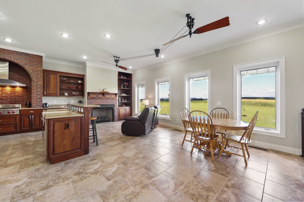 8007 Fountain Grove Road Morrison, TN 37357 - Photo 29 of 45 a view of kitchen with stainless steel appliances granite countertop dining table chairs cabinets and a stove