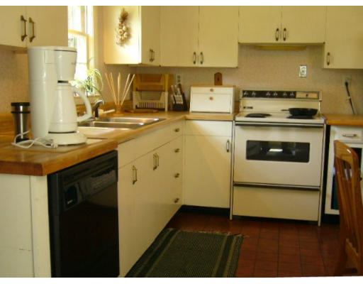 4 South Nelson Road Sterling, MA 01564 - Photo 18 of 21 a kitchen with a stove and a sink