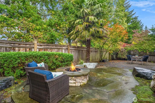 a backyard of a house with outdoor seating