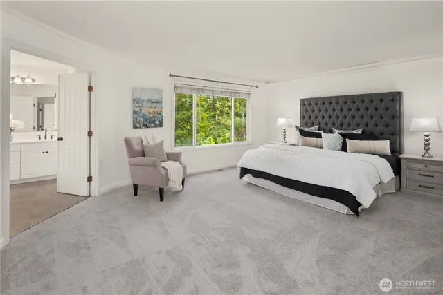 a bedroom with a bed and a couch