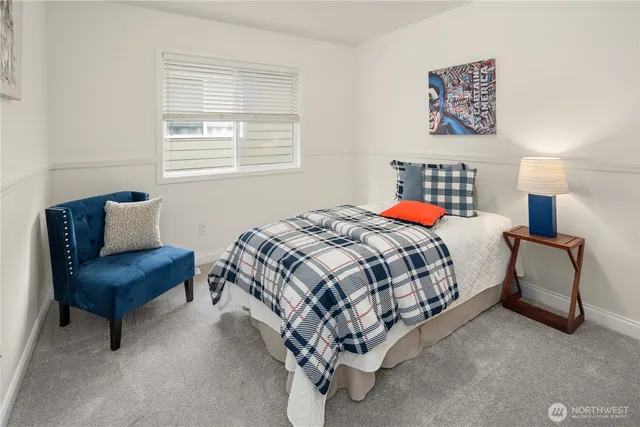 a bedroom with a bed and a couch