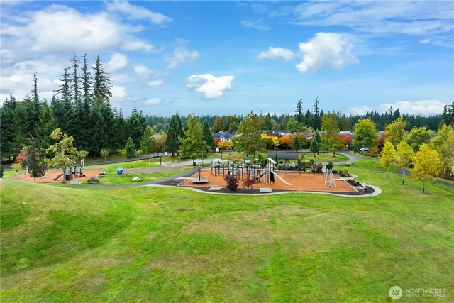 a view of a playground with houses