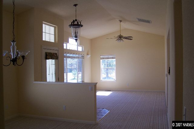 225 Koenig Road Reno, NV 89506 - Photo 3 of 9 wooden floor in an empty room with a window