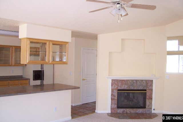 225 Koenig Road Reno, NV 89506 - Photo 6 of 9 a view of living room with granite countertop furniture and fireplace