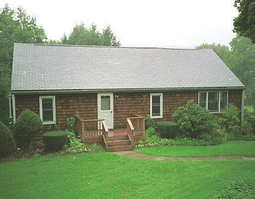 a backyard of a house with garden and barbeque oven