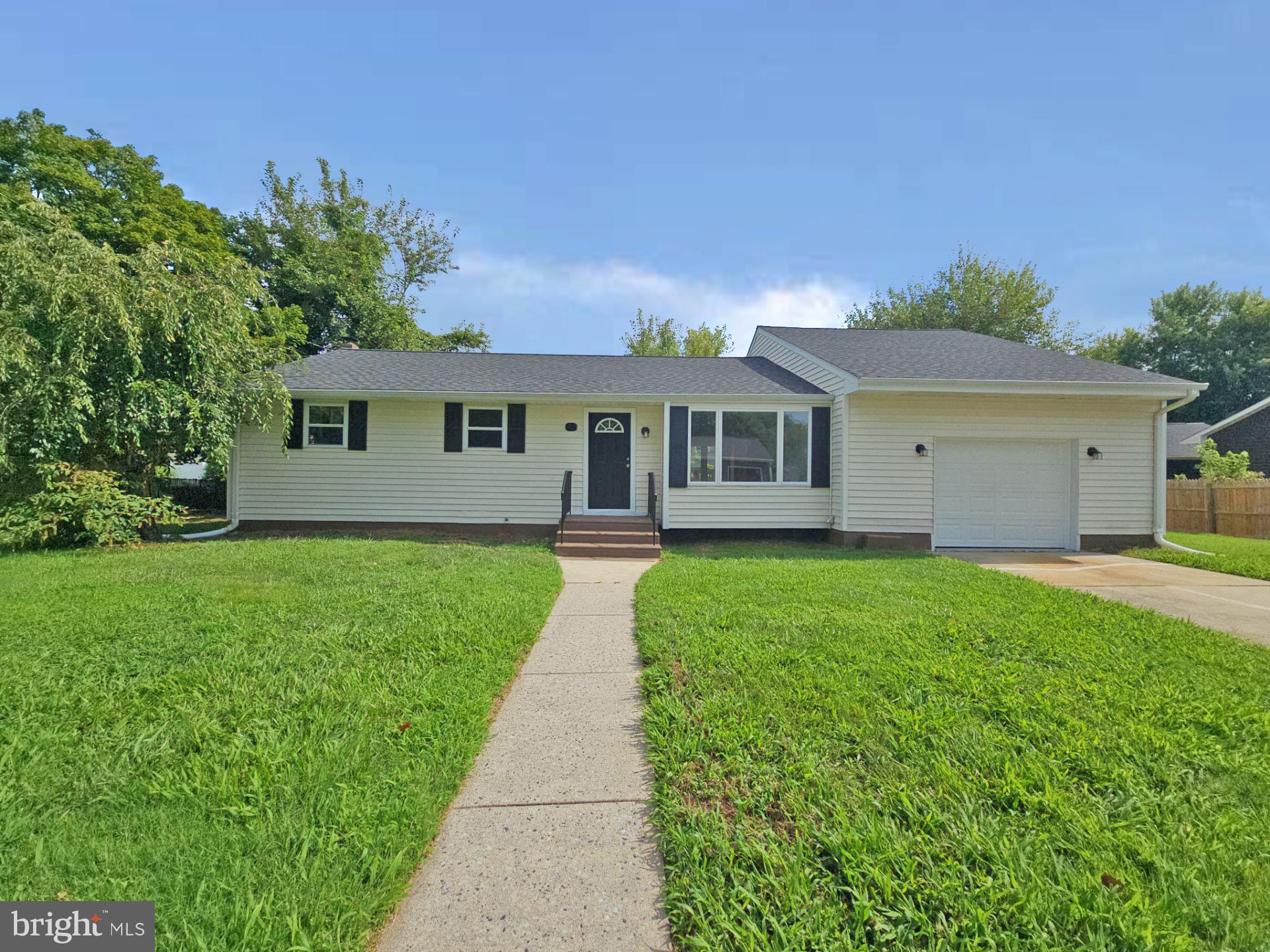82 Harvard Road Pennsville, NJ 08070 - Photo 1 of 18 a front view of house with yard and green space