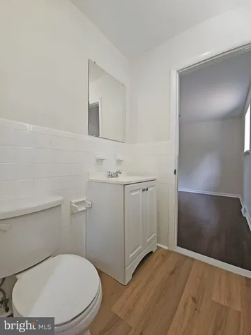 a bathroom with a toilet sink and shower