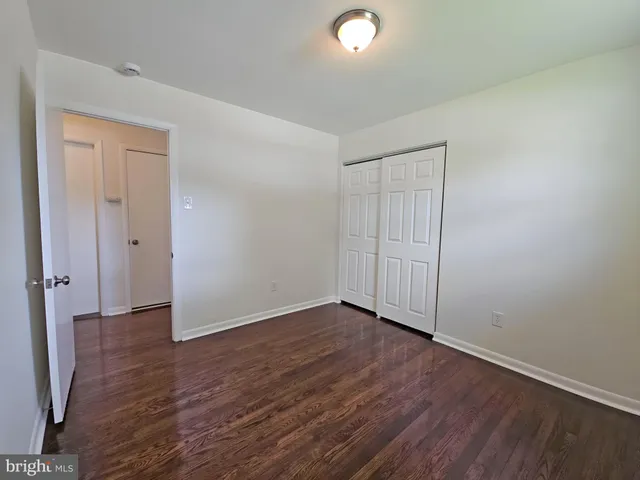 an empty room with wooden floor