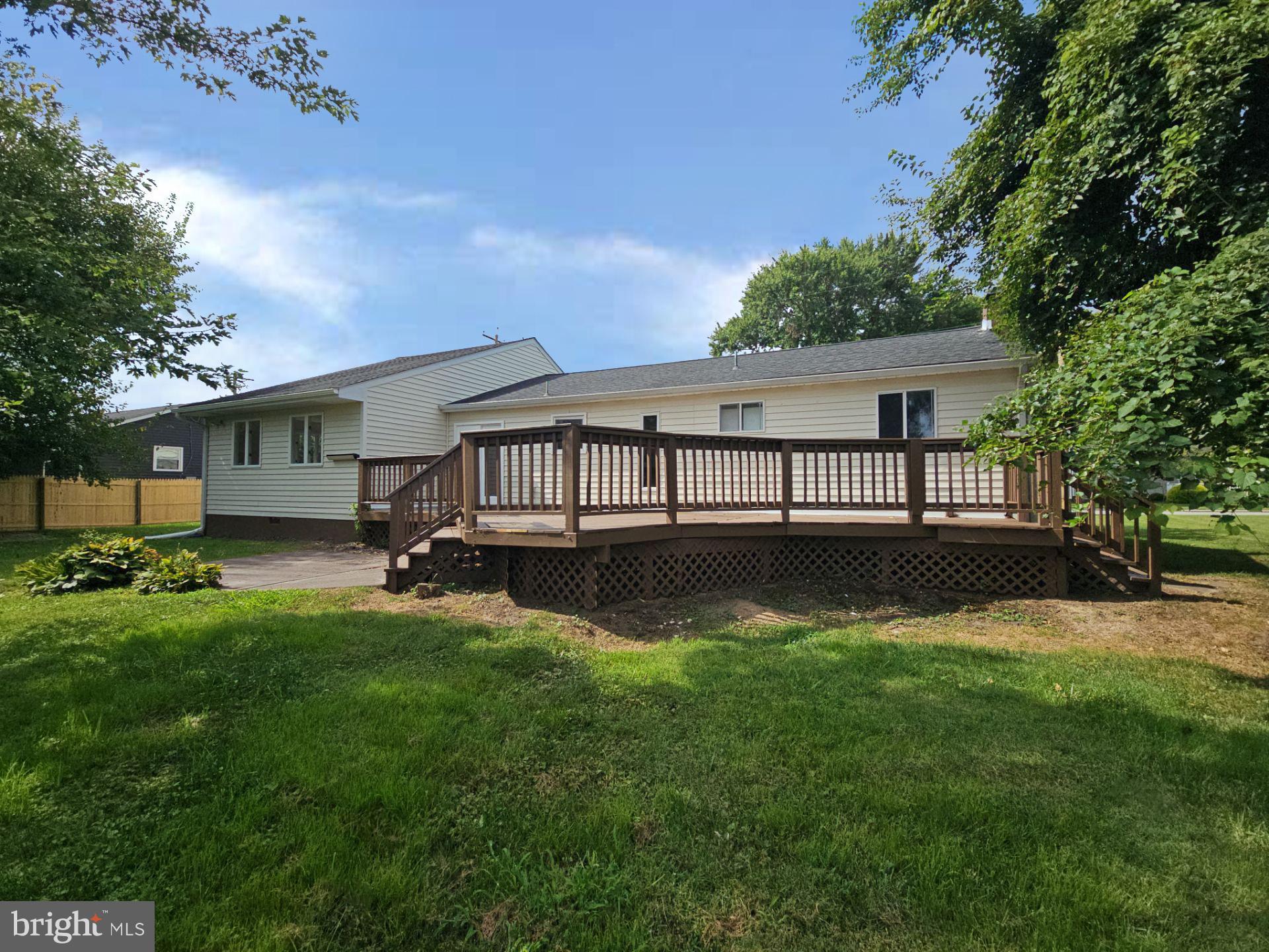 82 Harvard Road Pennsville, NJ 08070 - Photo 2 of 18 a view of a house with a yard and a large tree