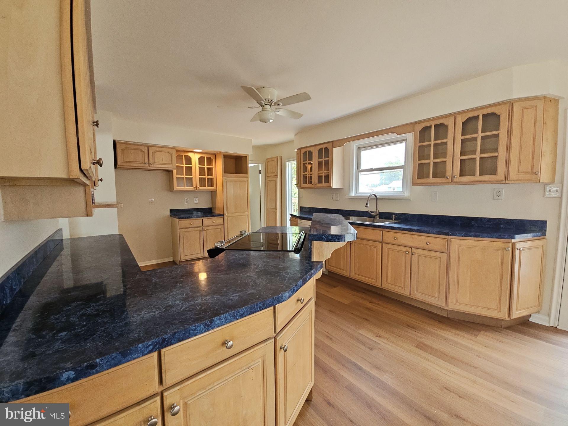 82 Harvard Road Pennsville, NJ 08070 - Photo 8 of 18 a kitchen with stainless steel appliances granite countertop a sink stove and cabinets