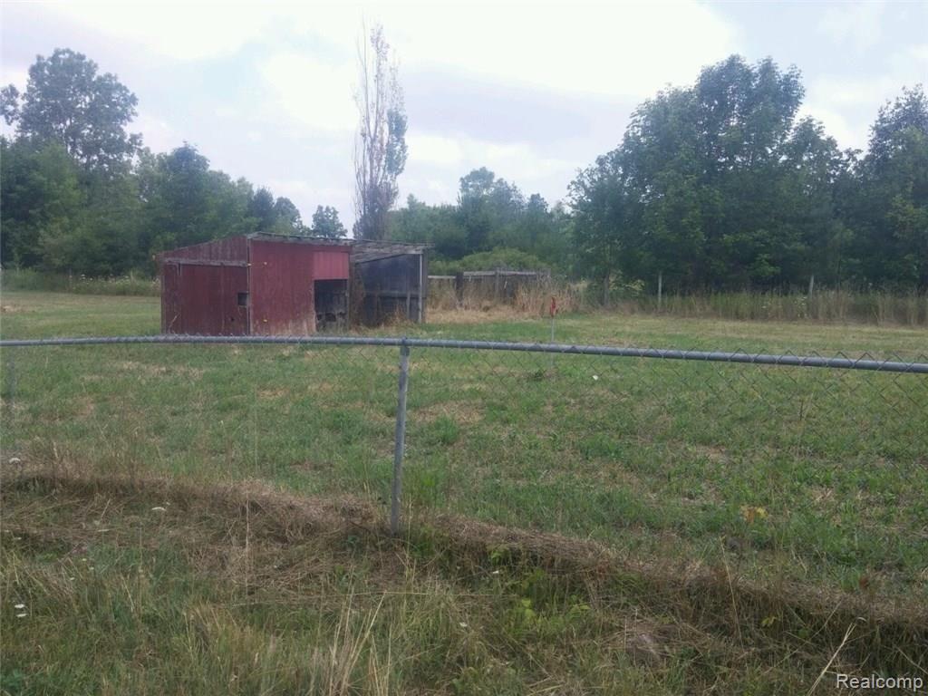 11321 McCaughna Road Byron, MI 48418 - Photo 5 of 12 11321 Fenced area and shed.jpg