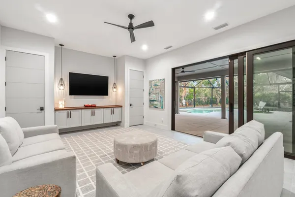 a swimming pool with outdoor seating