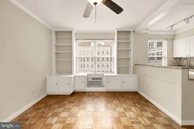 a view of a kitchen with a sink and a refrigerator