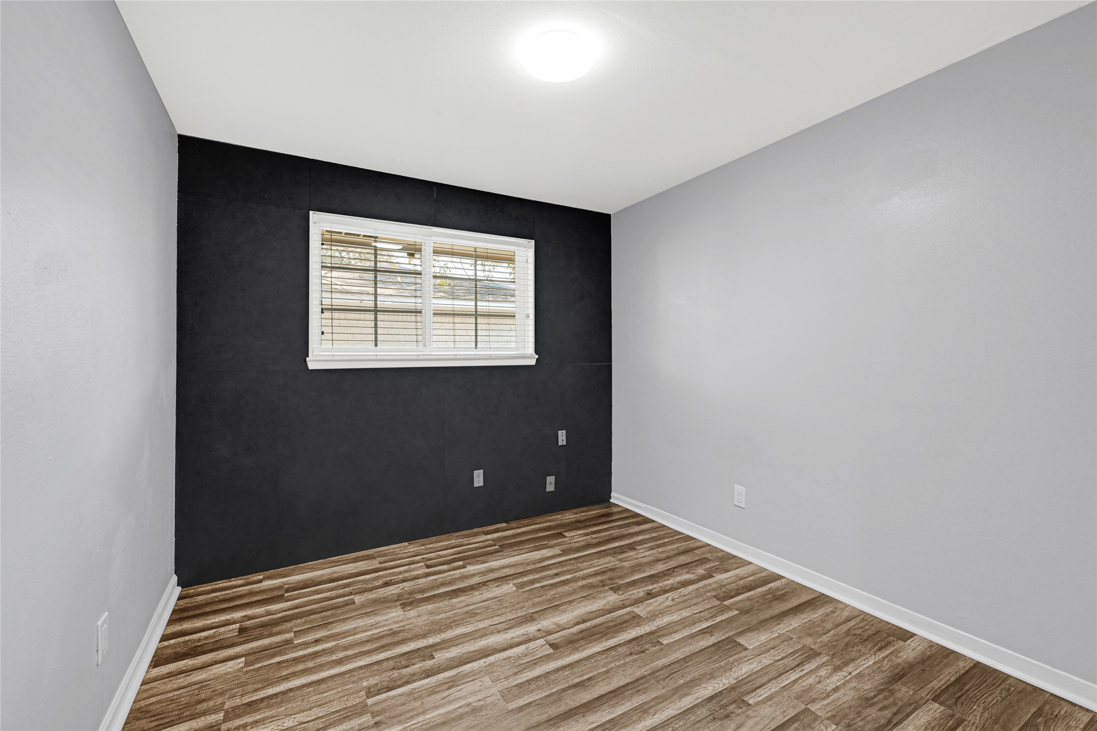 3603 Beau Lane Houston, TX 77039 - Photo 16 of 22 an empty room with wooden floor and windows