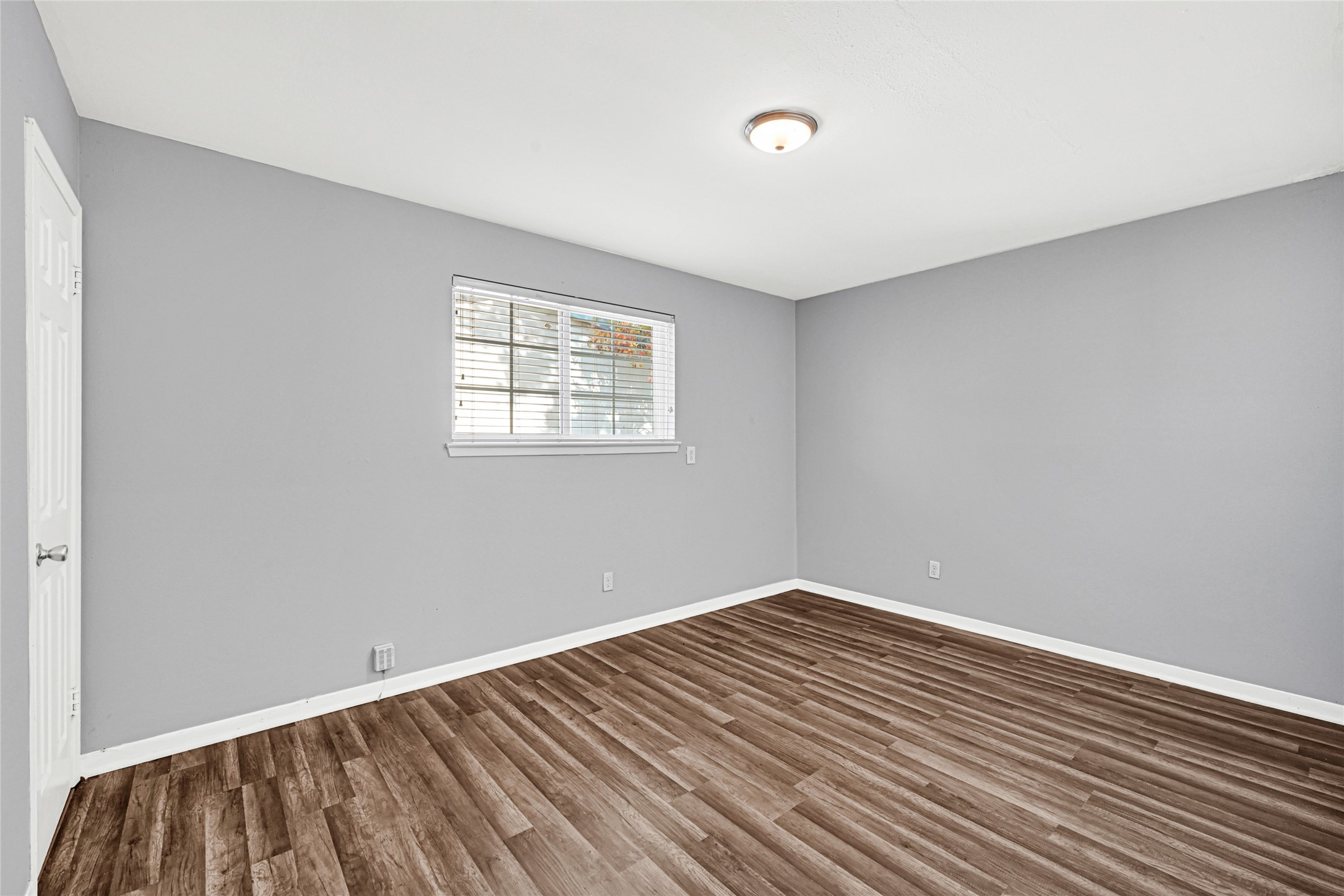 3603 Beau Lane Houston, TX 77039 - Photo 19 of 22 an empty room with wooden floor and windows
