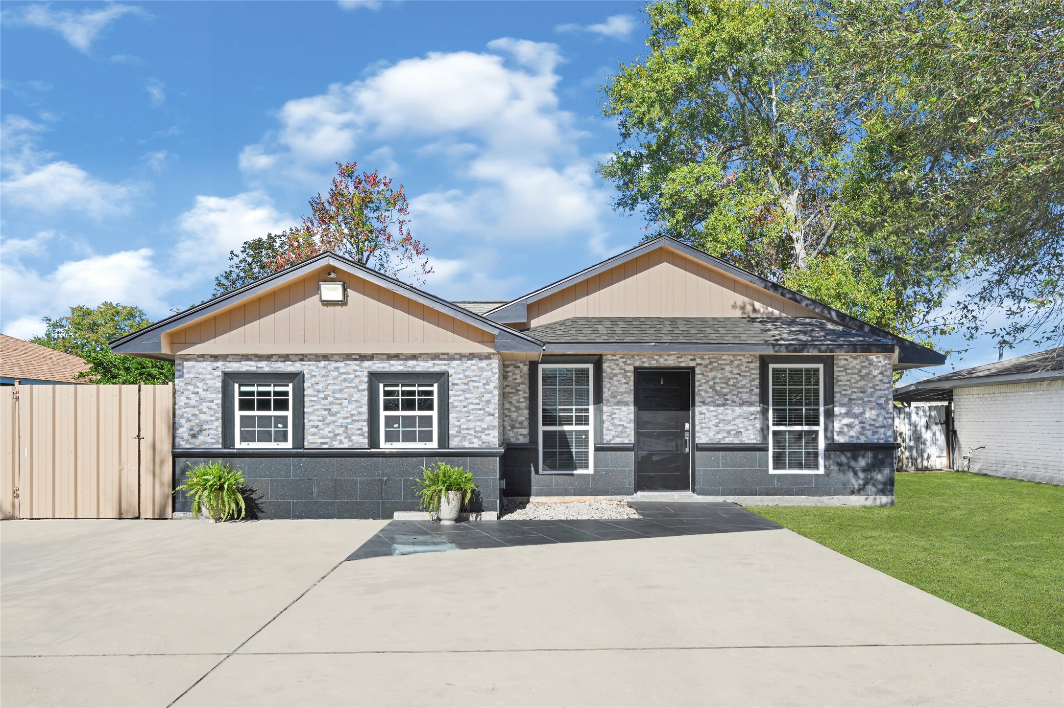 3603 Beau Lane Houston, TX 77039 - Photo 2 of 22 a front view of a house with a yard and garage