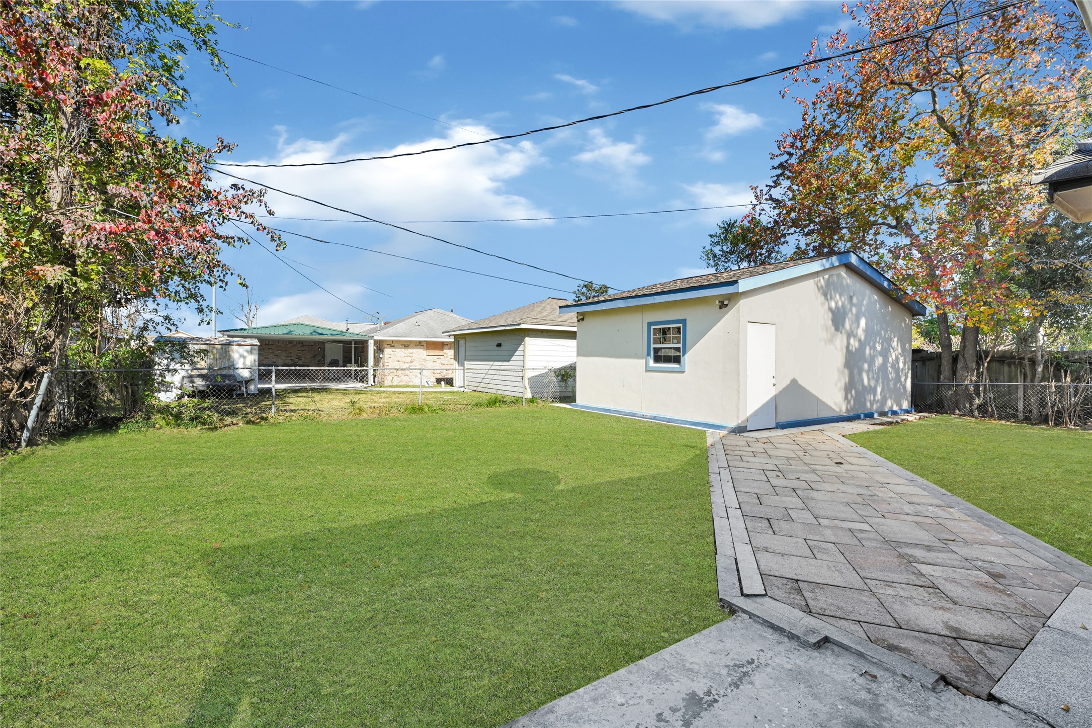 3603 Beau Lane Houston, TX 77039 - Photo 5 of 22 a view of a white house next to a yard with big trees