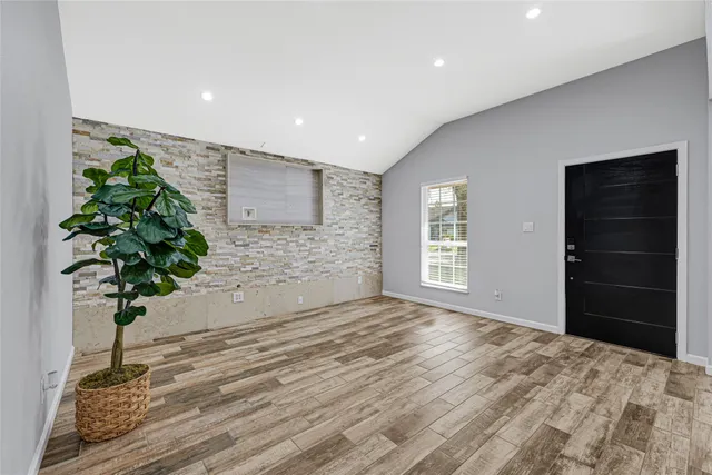 a view of empty room with a potted plant