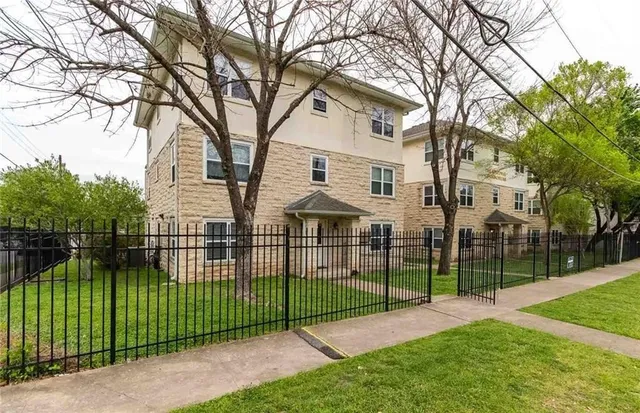 a view of a backyard with a garden and entertaining space