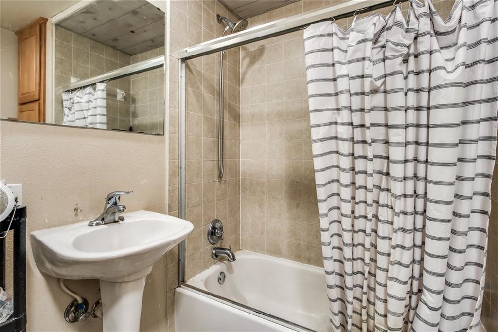 3011 Speedway, Unit 6 Austin, TX 78705 - Photo 11 of 11 a bathroom with a sink a toilet and shower