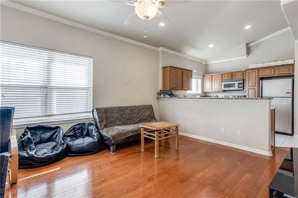 3011 Speedway, Unit 6 Austin, TX 78705 - Photo 2 of 11 a living room with stainless steel appliances granite countertop furniture and a kitchen view