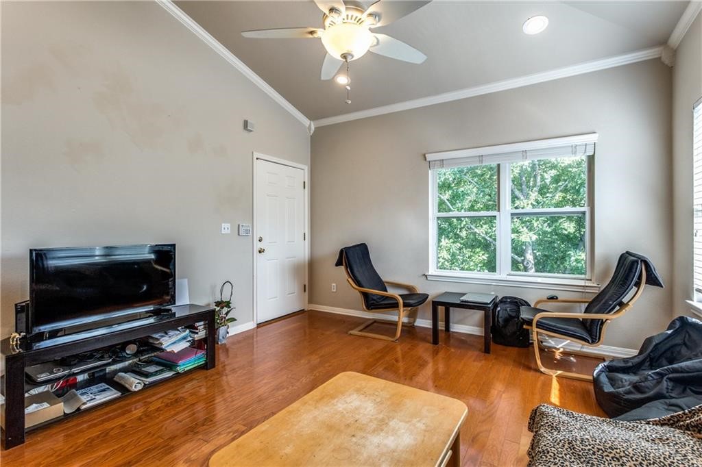 3011 Speedway, Unit 6 Austin, TX 78705 - Photo 3 of 11 a living room with furniture flat screen tv and a window
