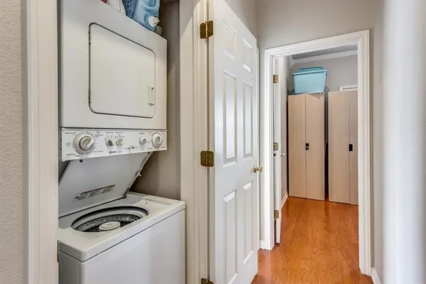 a view of a utility room with closet dryer and washer