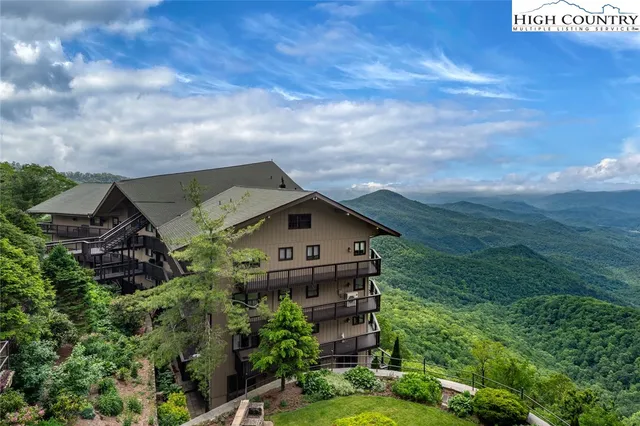 a view of a large building with a yard