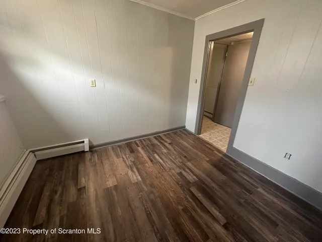 a bathroom with a sink a toilet a mirror and window