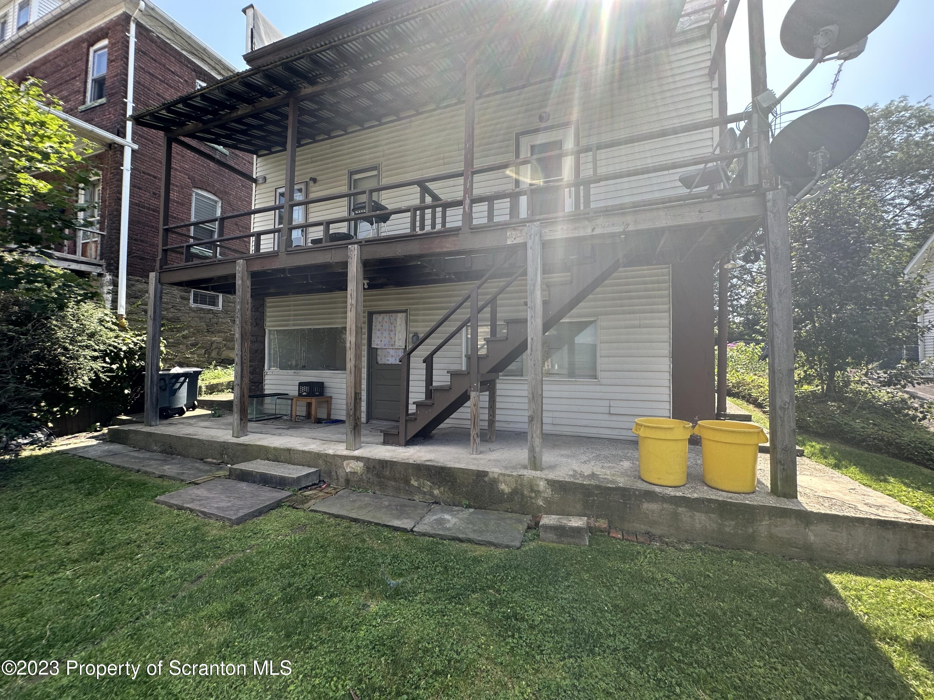 130 State Street, Unit ST Nanticoke, PA 18634 - Photo 8 of 8 a view of a house with backyard and a patio