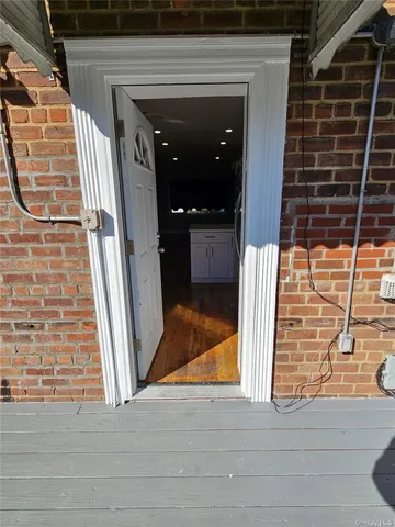a view of entryway with wooden stairs