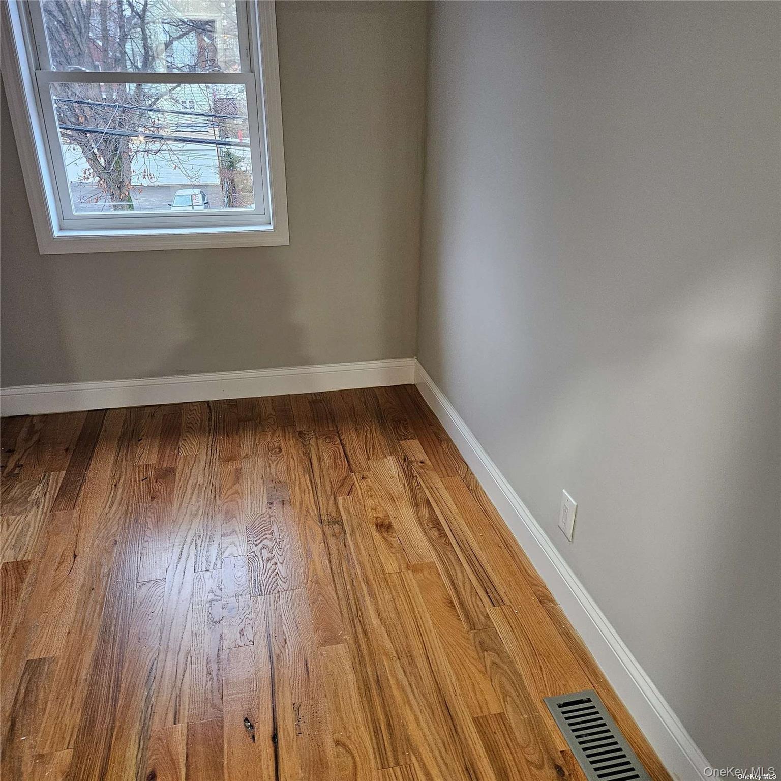 1918 Hunt Avenue Bronx, NY 10462 - Photo 6 of 15 a view of wooden floor in a window