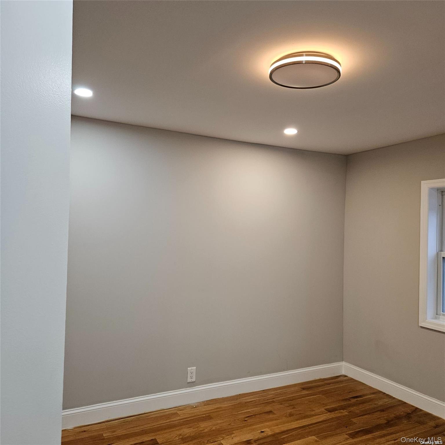 1918 Hunt Avenue Bronx, NY 10462 - Photo 9 of 15 a view of empty room with wooden floor