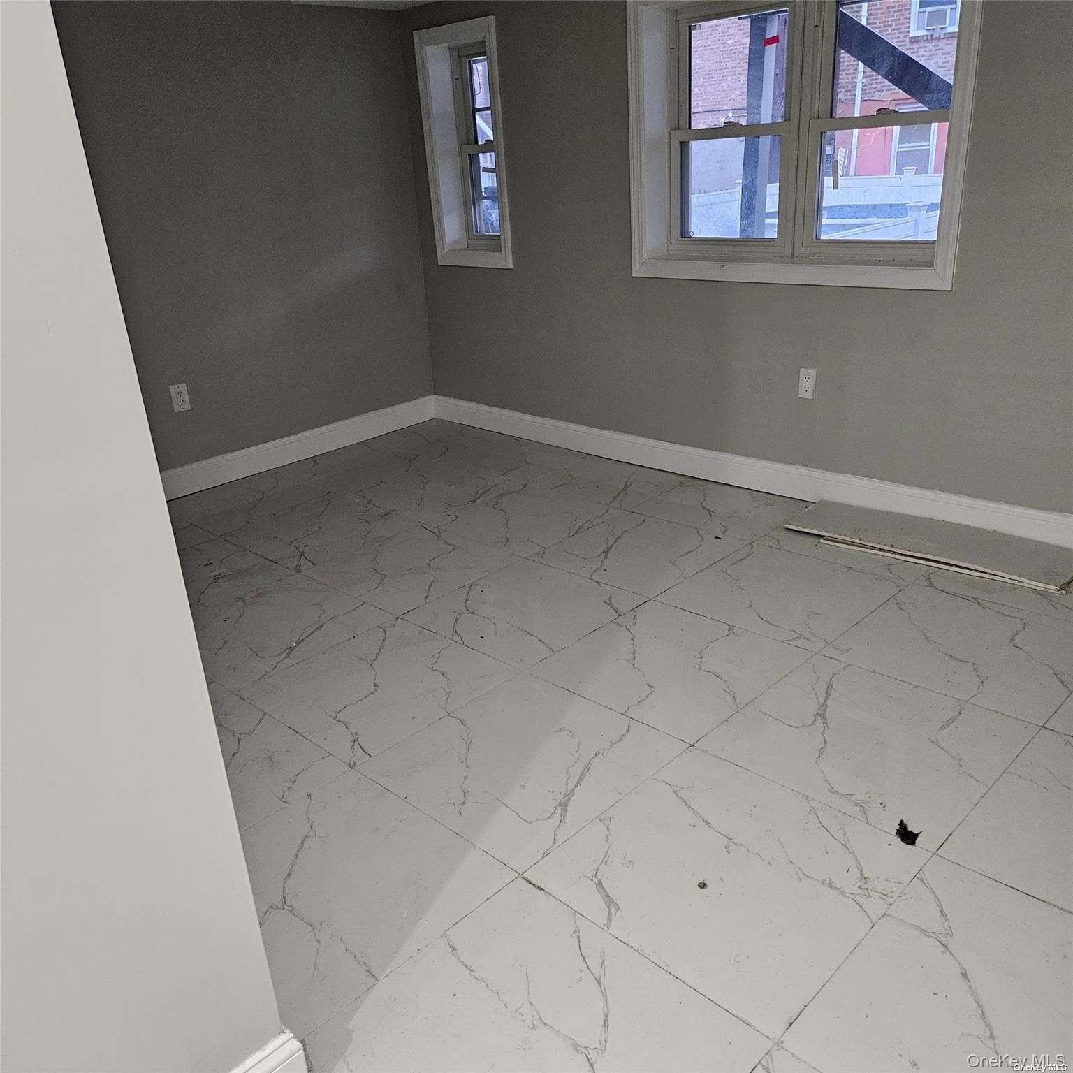 1918 Hunt Avenue Bronx, NY 10462 - Photo 10 of 15 an empty room with windows