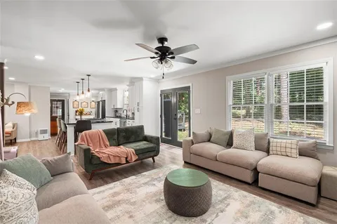 a living room with furniture and a large window