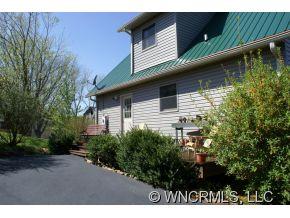 28 Hampton Road Leicester, NC 28748 - Photo 20 of 22 a backyard of a house with lots of green space