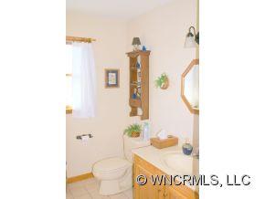 28 Hampton Road Leicester, NC 28748 - Photo 7 of 22 a bathroom with a sink and a mirror