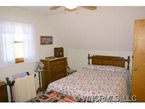 28 Hampton Road Leicester, NC 28748 - Photo 9 of 22 a bedroom with a bed and a desk