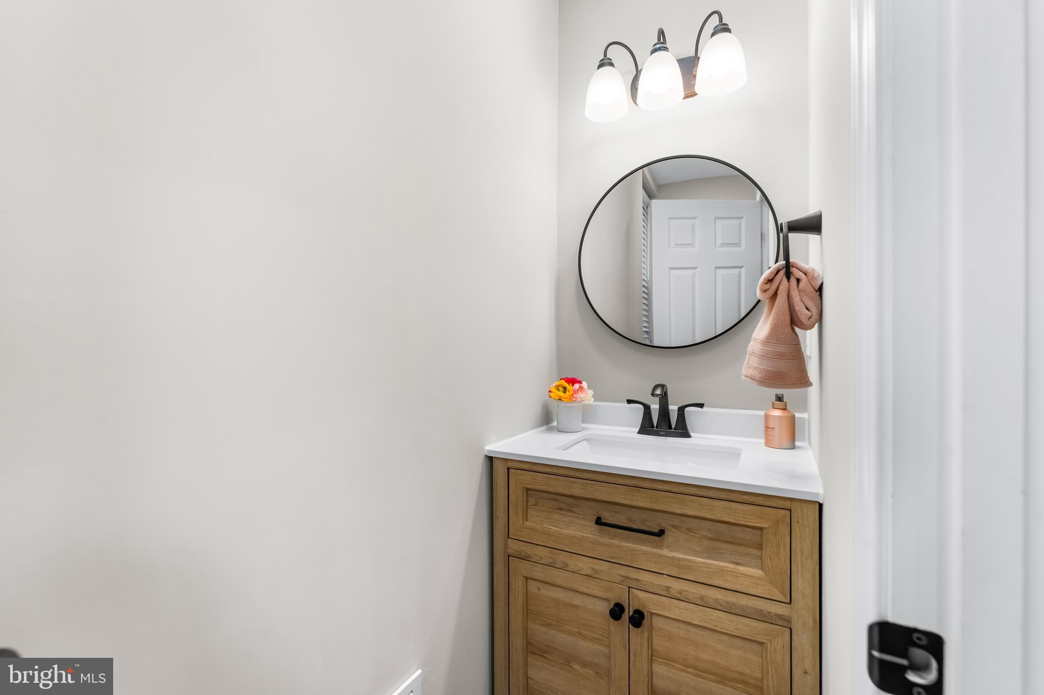 1261 Riverside Avenue Baltimore, MD 21230 - Photo 16 of 60 a bathroom with a sink and a mirror